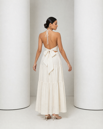 Back of the cream Alva dress, open back with the sash tied in a bow at the waist