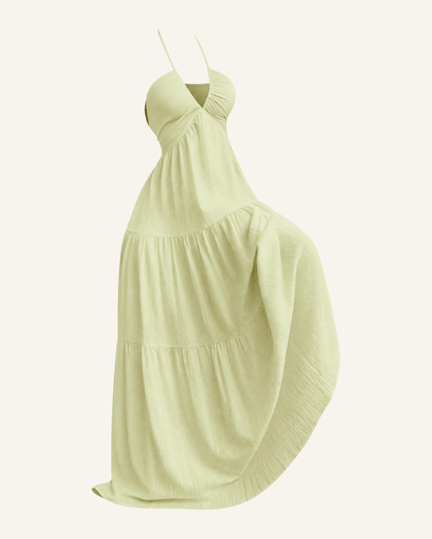 The Alva halter tiered maxi dress in pale lime, shown alone against a bone background, full length