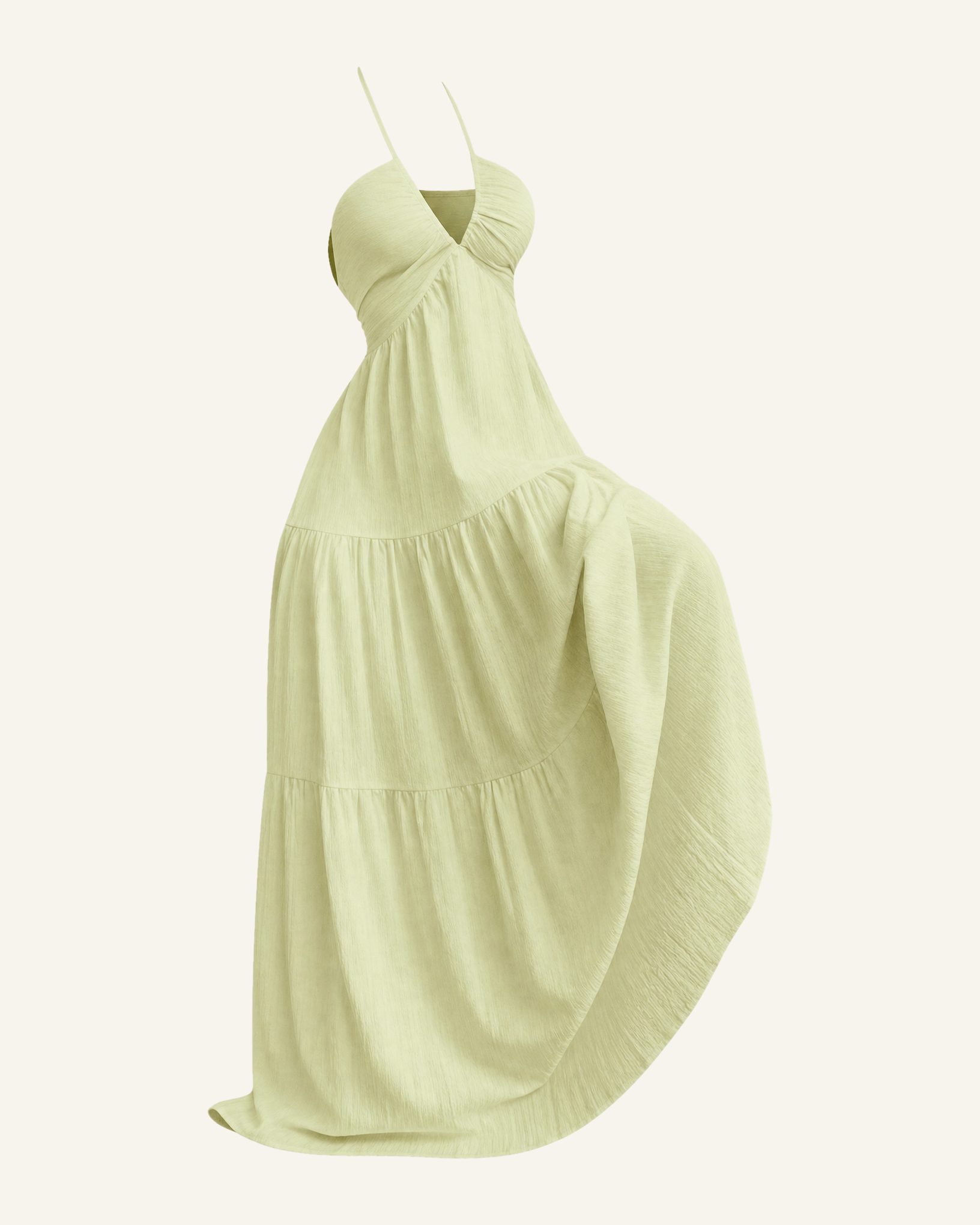The Alva halter tiered maxi dress in pale lime, shown alone against a bone background, full length