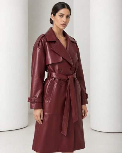 Close view of the Alya burgundy trench, wide notched lapels, storm flap and double-breasted buttons