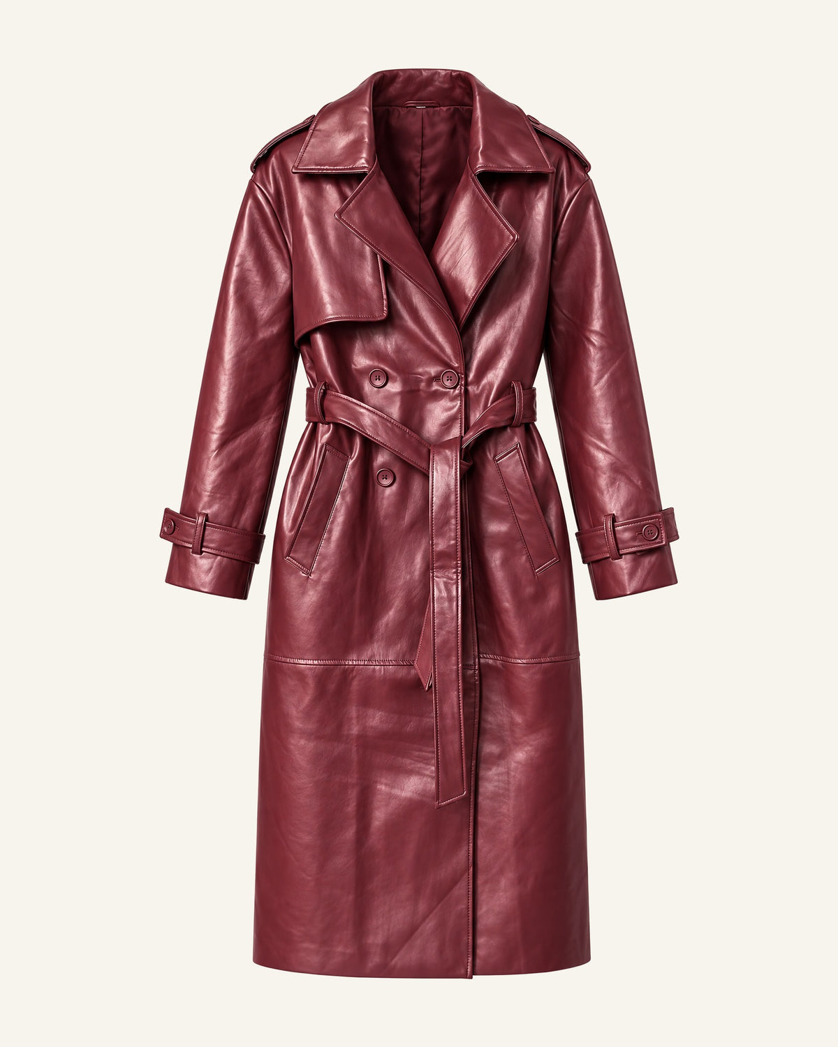 The Alya vegan leather trench in burgundy shown alone on a bone background, belted, front view