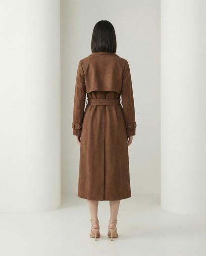 Suede trench from the back showing the shoulder yoke, back belt and centre vent at mid-calf