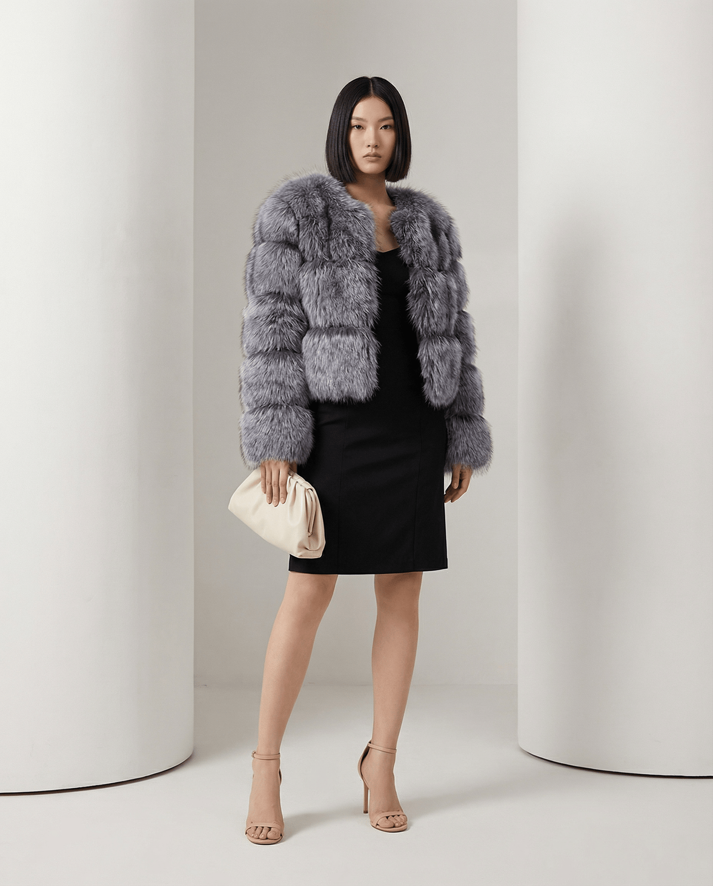 Glacier grey Astra faux-fur jacket with banded pile panels, worn front on over a black dress