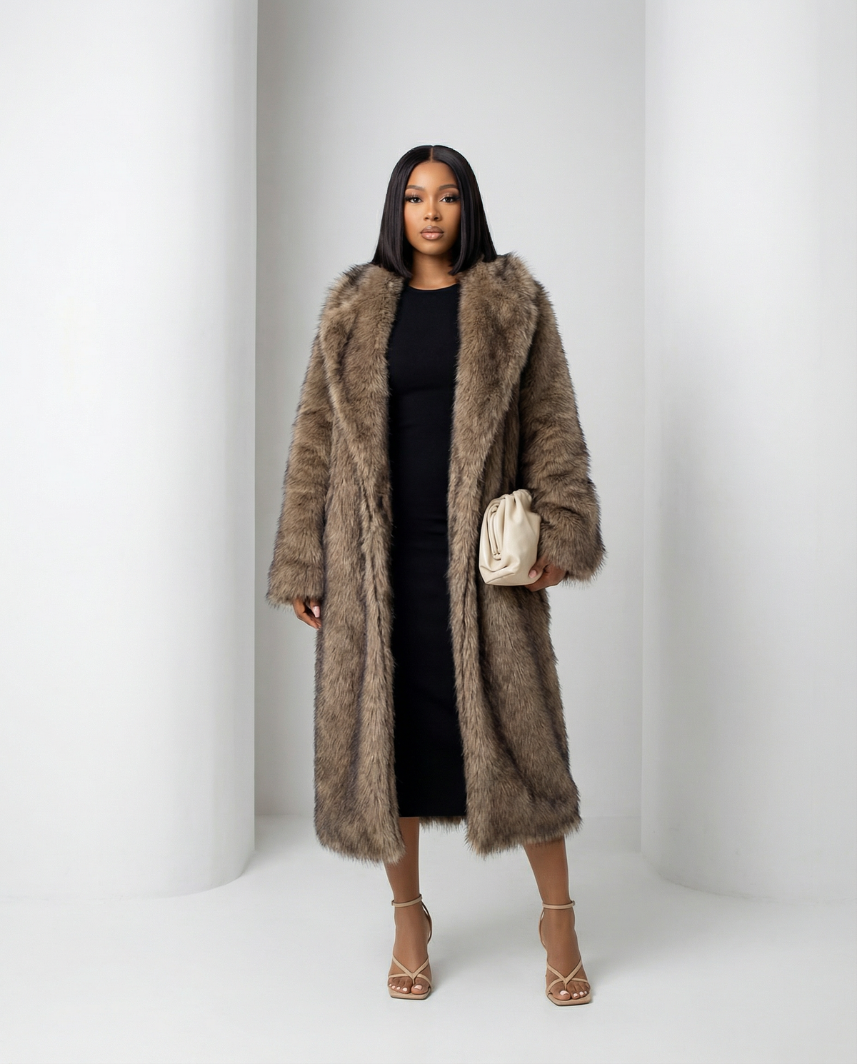 Beige Eden longline faux-fur coat with a wide shawl collar, straight-on front view, full length