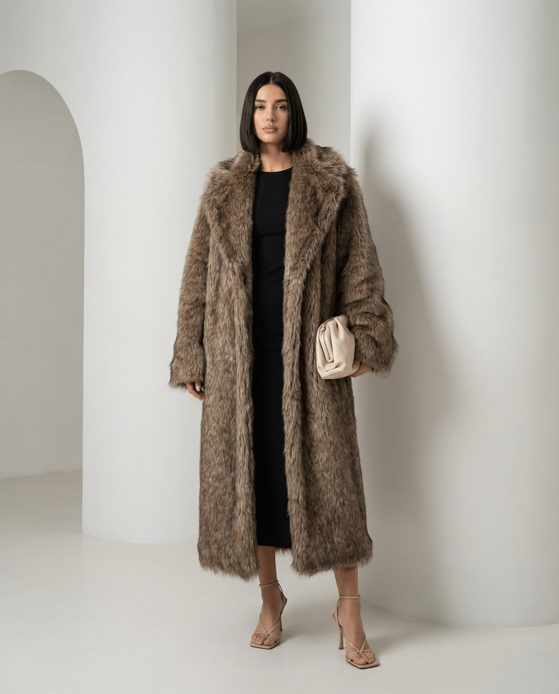 Beige longline faux-fur coat with deep collar and turned-back cuffs, three-quarter view, full length