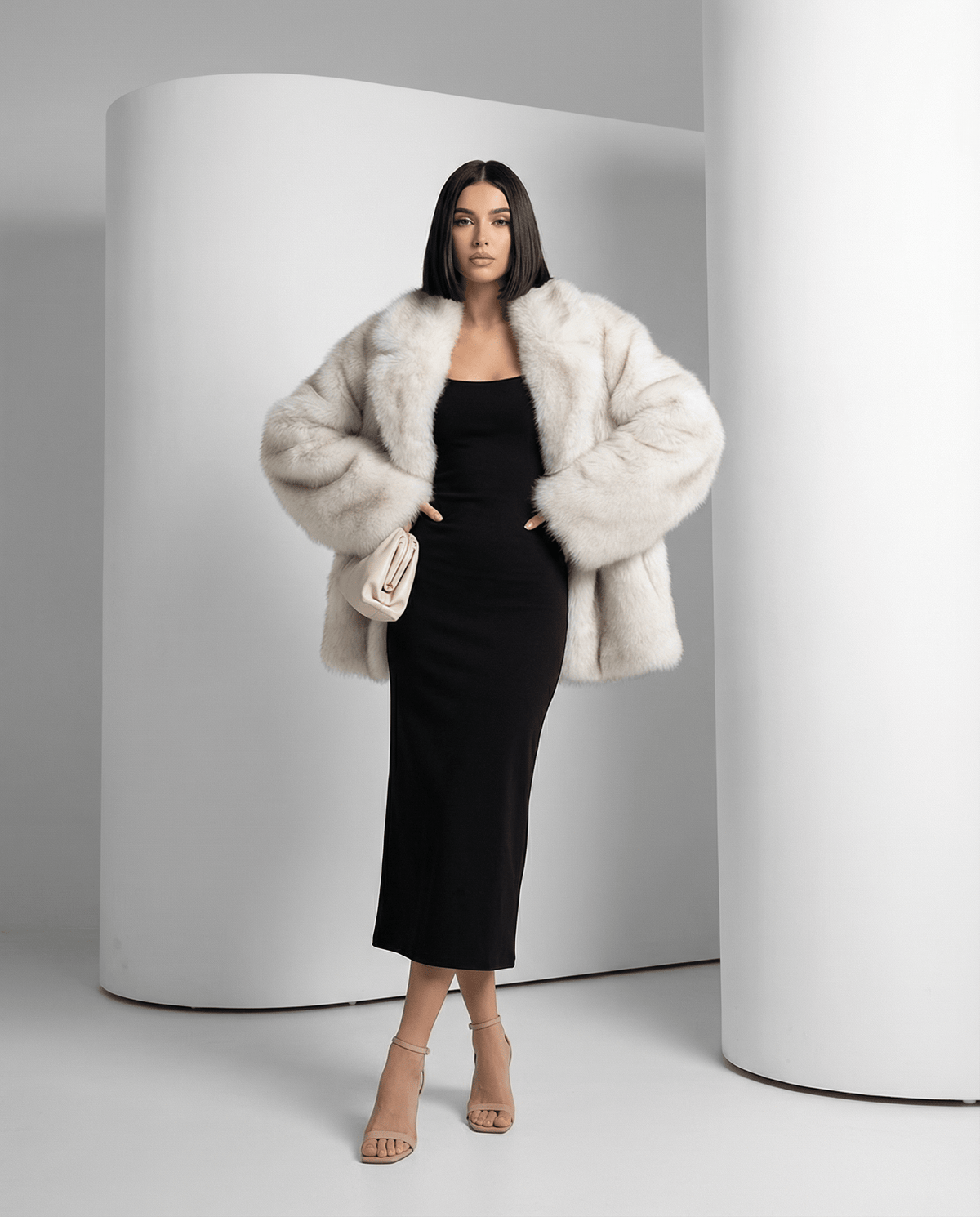 Frosted white faux-fur coat with hands in pockets, showing the oversized shoulder and sleeve