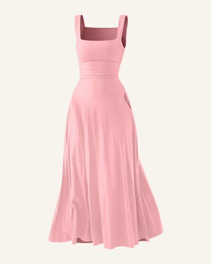 The Elin corset back midi dress in soft pink, shown alone against a bone background, full length