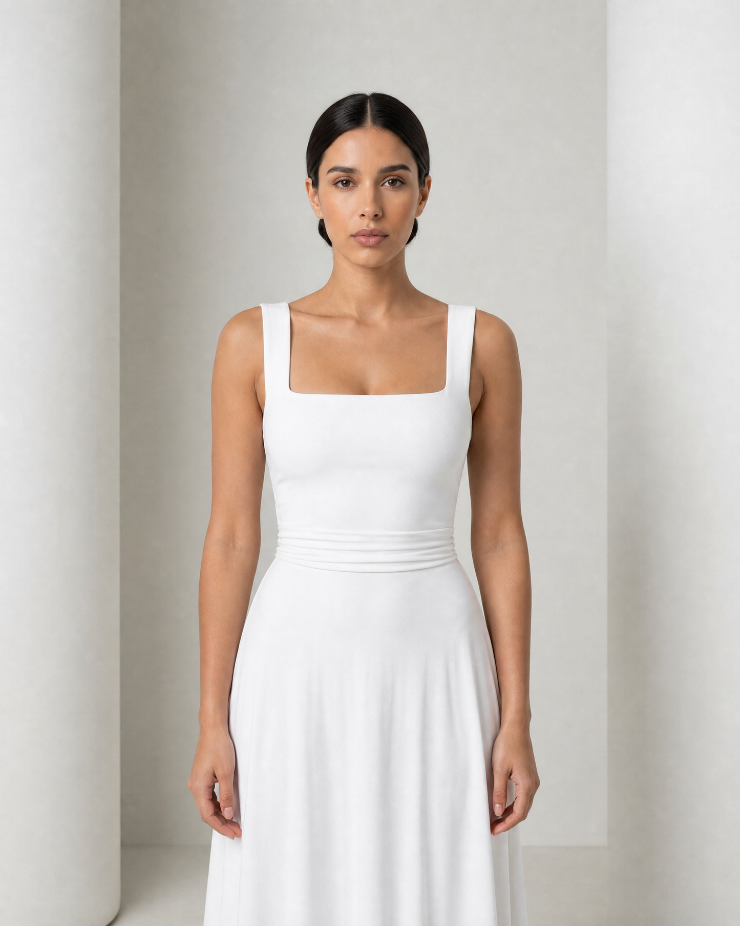 Close view of the Elin bodice in white, the square neckline and two wide shoulder straps