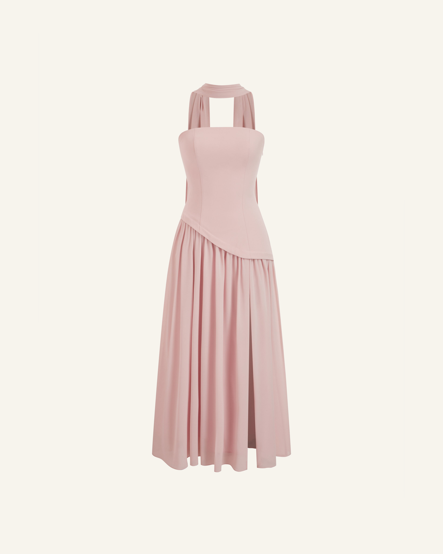 Model in the Embla lace-back chiffon maxi in blush, strapless bodice and the high side slit open