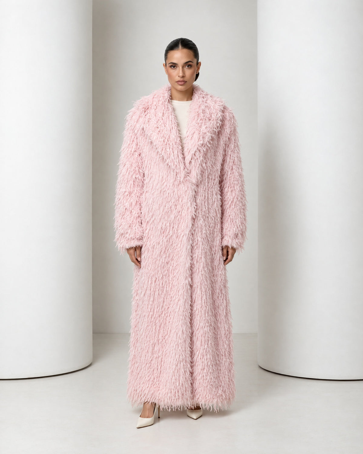 Freja faux feather long coat in blush, full-length front view worn closed over ivory