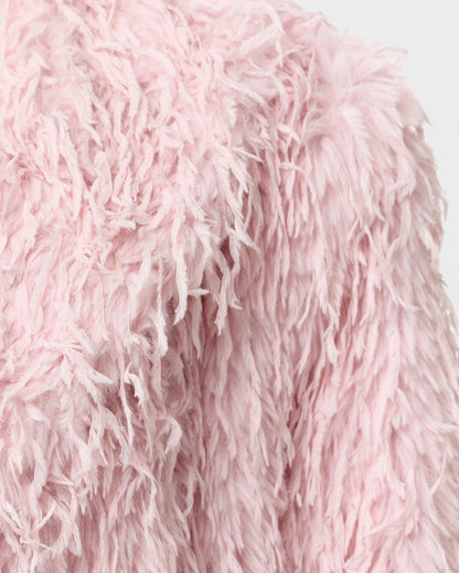 Detail of the wide notched lapel and shoulder on the Freja blush coat