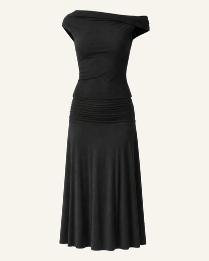 The Hedda top and midi skirt set in black, shown alone against a bone background, full length