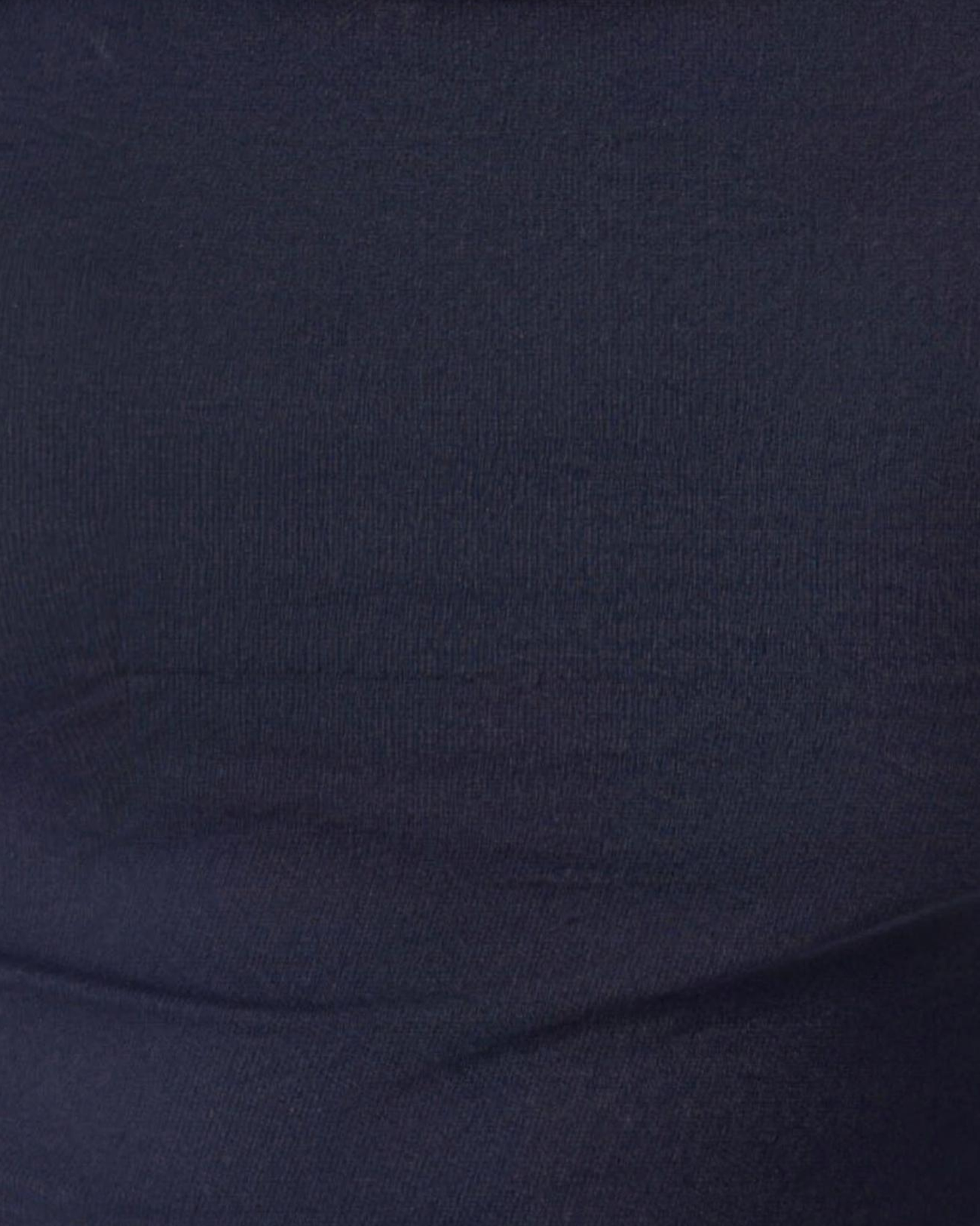 Macro of the Hedda matte rib knit, fine vertical texture running through the fabric