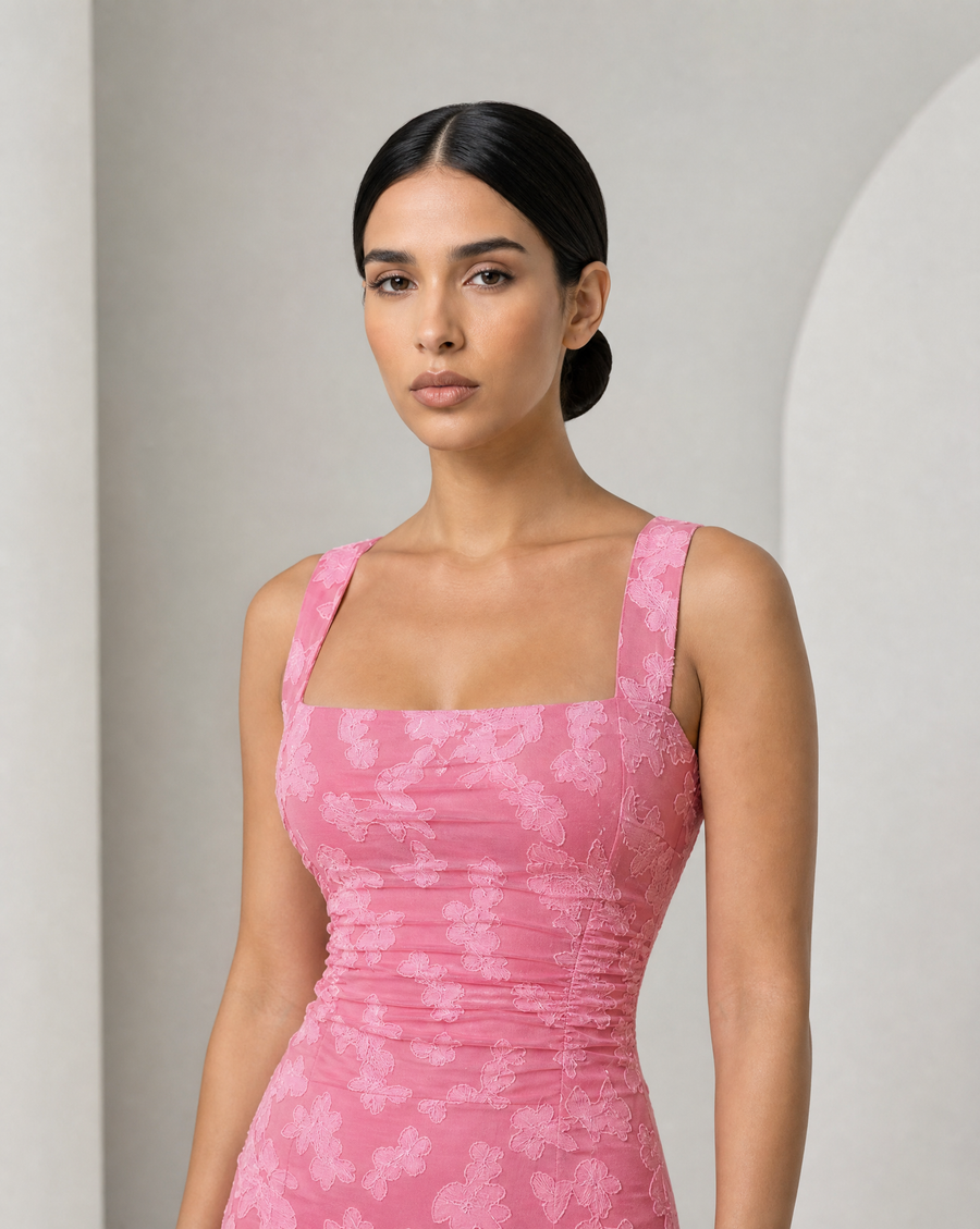 Model in the Ilva ruffle mermaid maxi in rose, square neck, ruched bodice and tiered ruffle hem