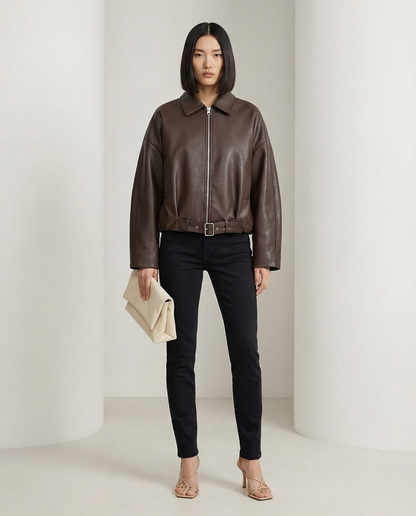 Bitter chocolate cropped jacket buckled at the waist, front view with collar and zip detail