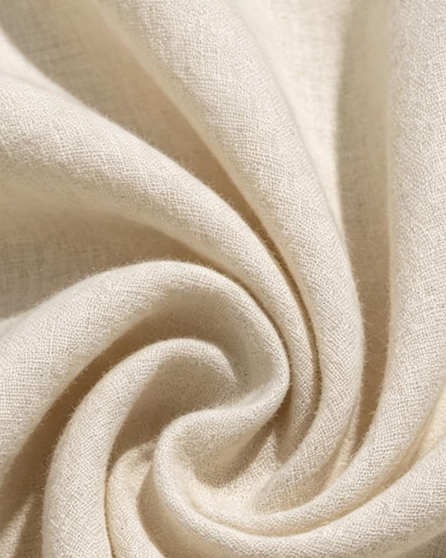 Macro of the Linnea oatmeal fabric, showing the slubbed matte weave and the way it folds