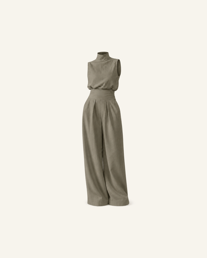 The Linnea pleated wide-leg set in sage green, mock-neck top and pleated wide-leg trousers, alone on a bone background