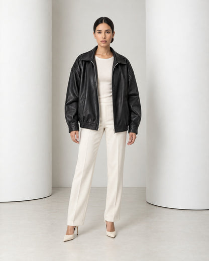 Liv oversized faux leather jacket in black, full-length front view worn open over ivory