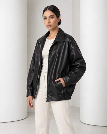 Close view of the Liv jacket in black, point collar and open silver front zip