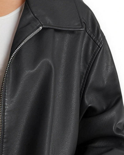 Detail of the point collar, silver zip and dropped shoulder seam on the Liv black jacket