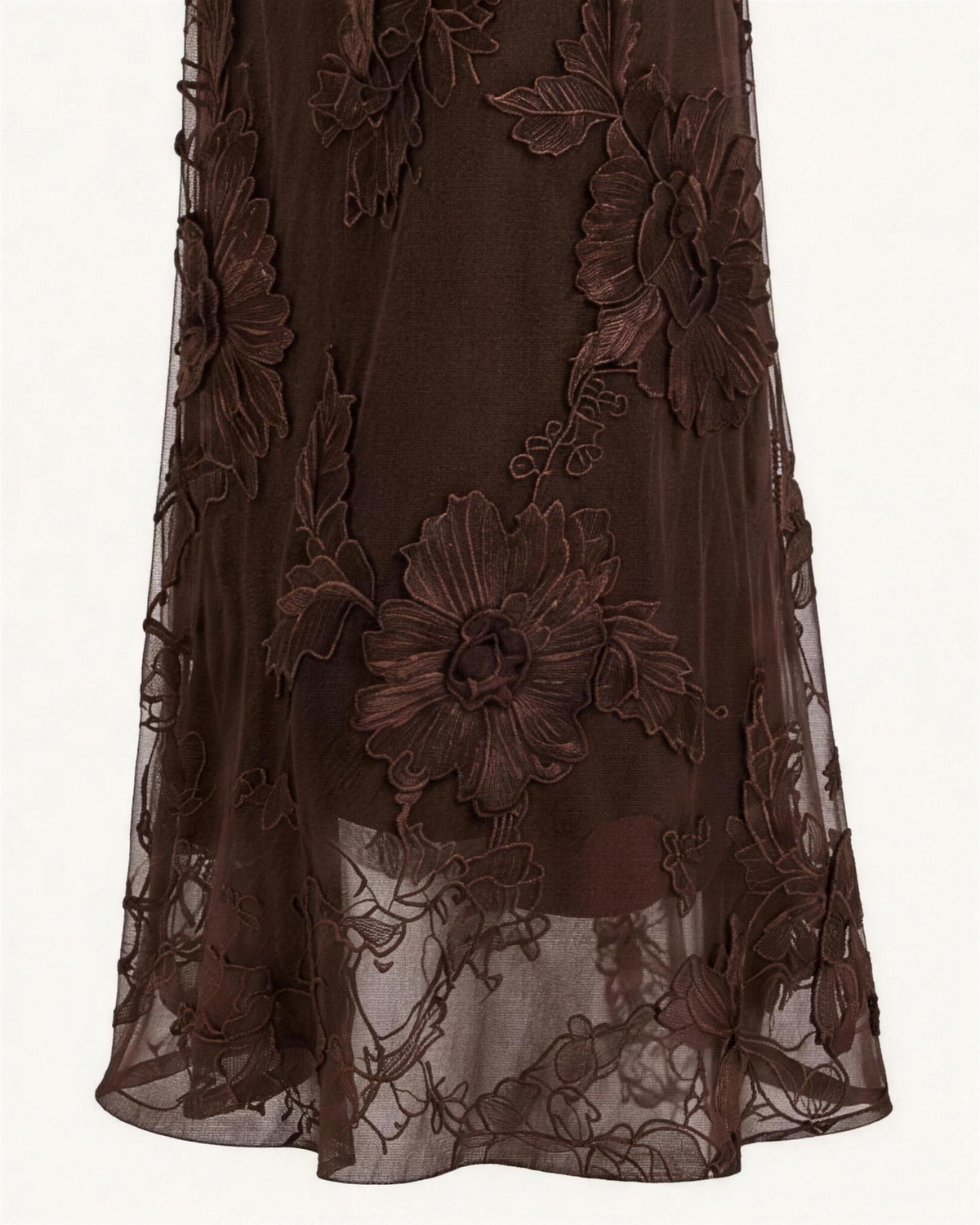 Macro of the Maren mesh, raised floral appliqué stitched over a sheer stretch ground