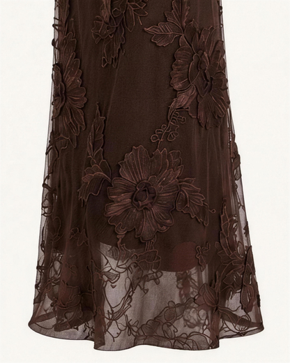 Macro of the Maren mesh, raised floral appliqué stitched over a sheer stretch ground