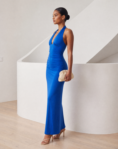 Meridiane halter maxi in cobalt blue from the side, ruched waist easing into a long column skirt