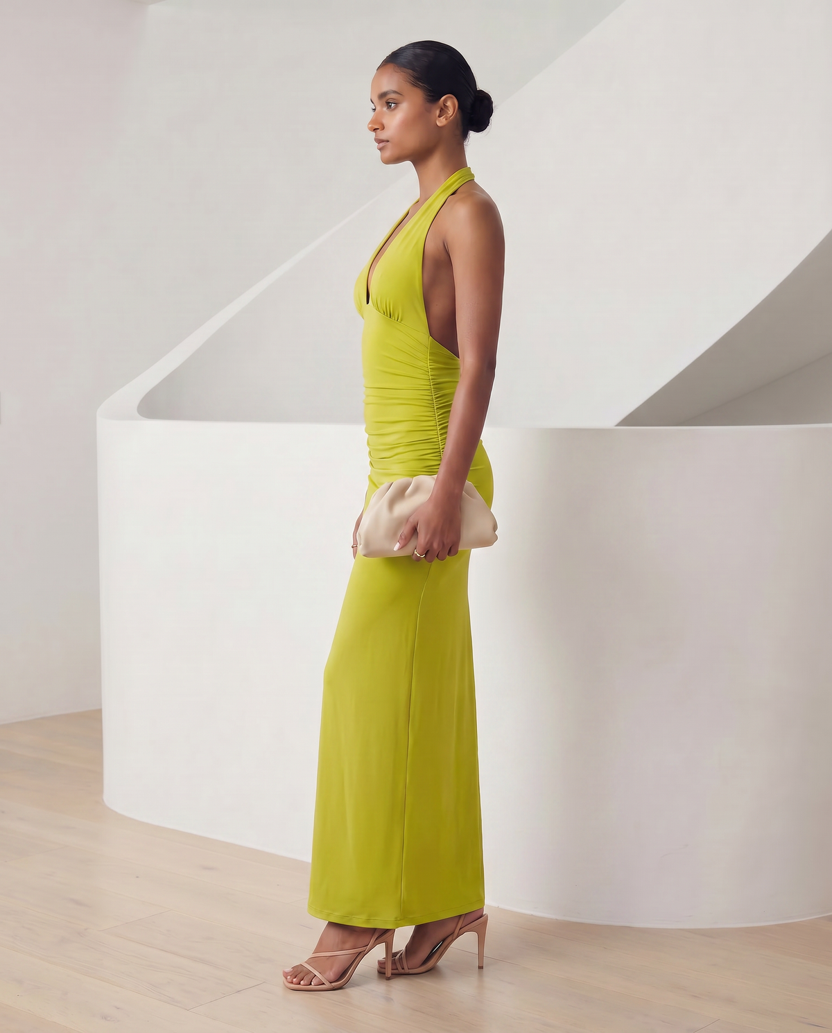 Meridiane halter maxi in chartreuse matcha green, side profile with the hem grazing the floor