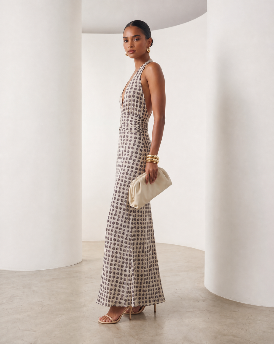 Ivory Mira sundress with brown polka-dot print and a plunging halter neck, full-length front view