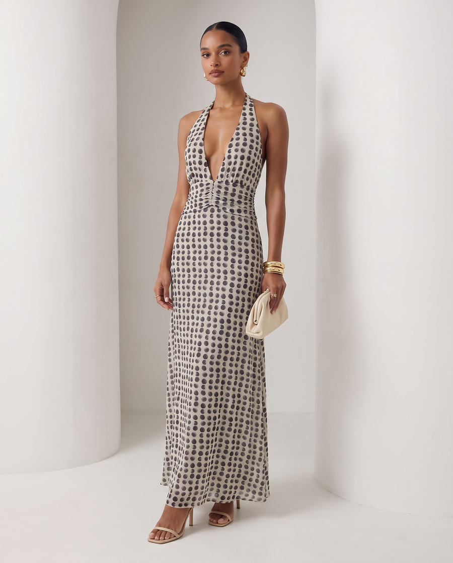 Ivory Mira sundress with brown polka-dot print and a plunging halter neck, full-length front view