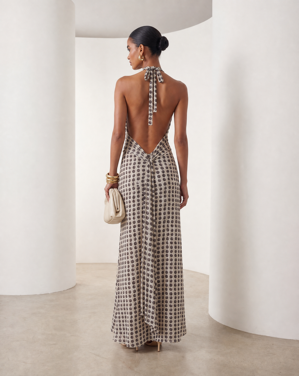 Printed halter maxi from the back, low open back with neck ties and a floor-skimming hem