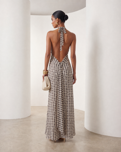 Printed halter maxi from the back, low open back with neck ties and a floor-skimming hem