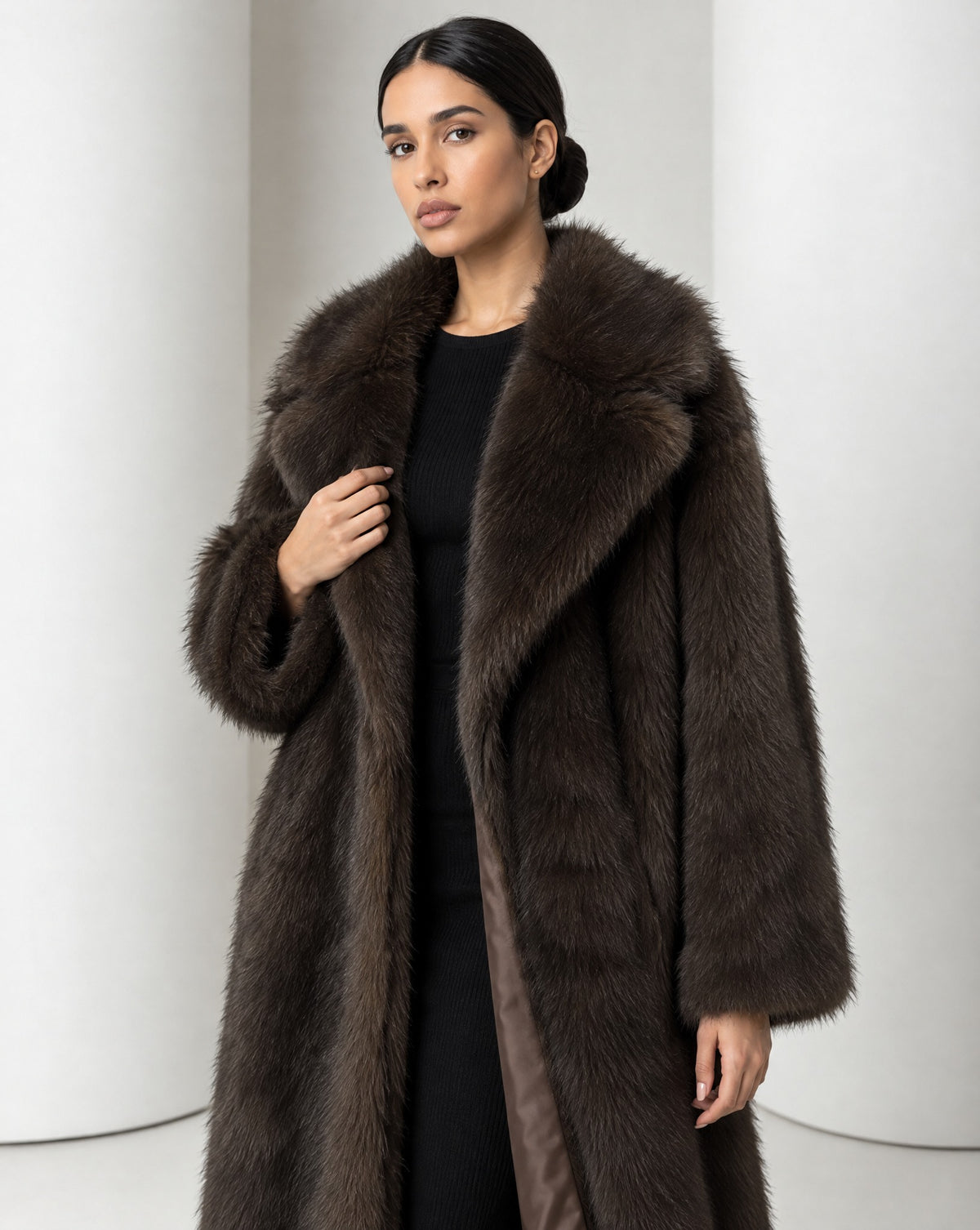 Close view of the Mirella bitter chocolate faux-fur coat, wide notched lapels and long shaggy pile