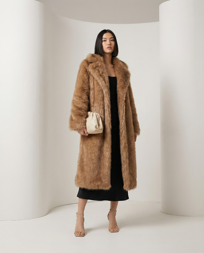 Amber fox faux-fur coat with a deep shawl collar, three-quarter view over a black slip dress
