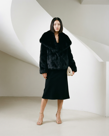 Neriah faux-fur jacket in black, three-quarter view showing the cropped hip-length hem