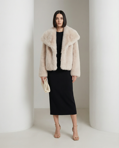 Pale cream cropped faux-fur jacket with an oversized collar, worn over a black column midi dress