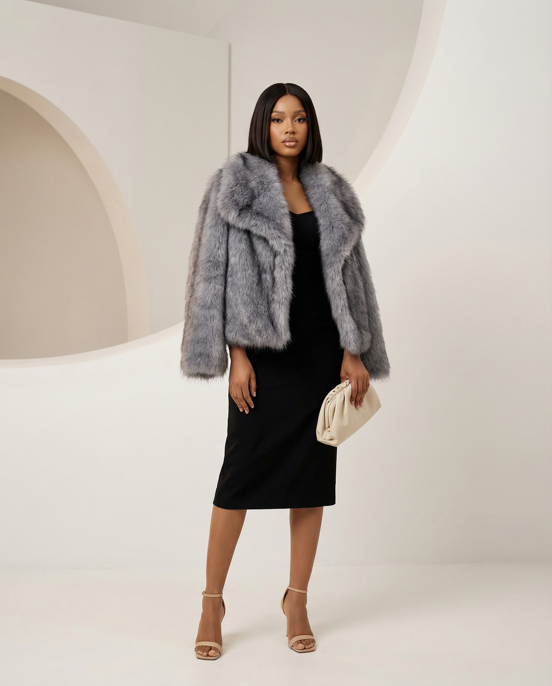 Neriah faux-fur jacket in gray, front view with the wide collar framing a black midi dress