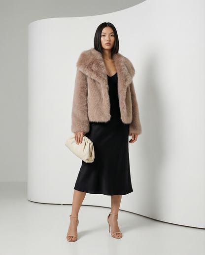Neriah faux-fur jacket in rose gold, front view with a cream clutch held at the waist