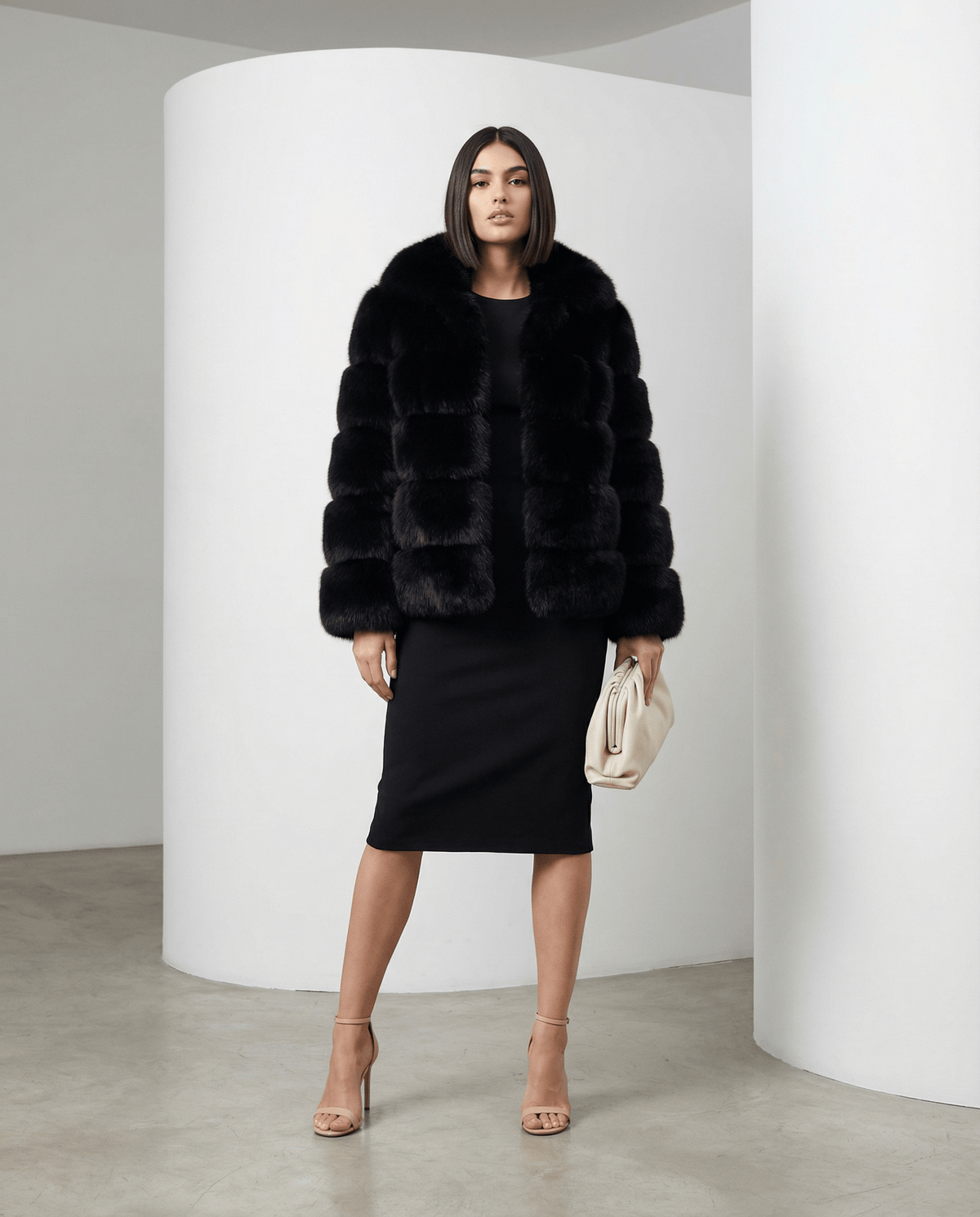 Black Nova faux-fur bubble jacket worn open over a black midi pencil dress, full length front view