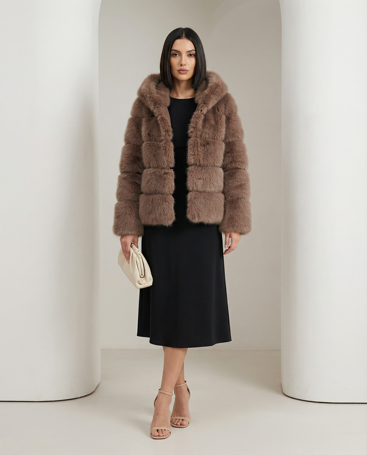 Taupe brown Nova faux-fur bubble jacket worn open over a black midi dress, full length front view