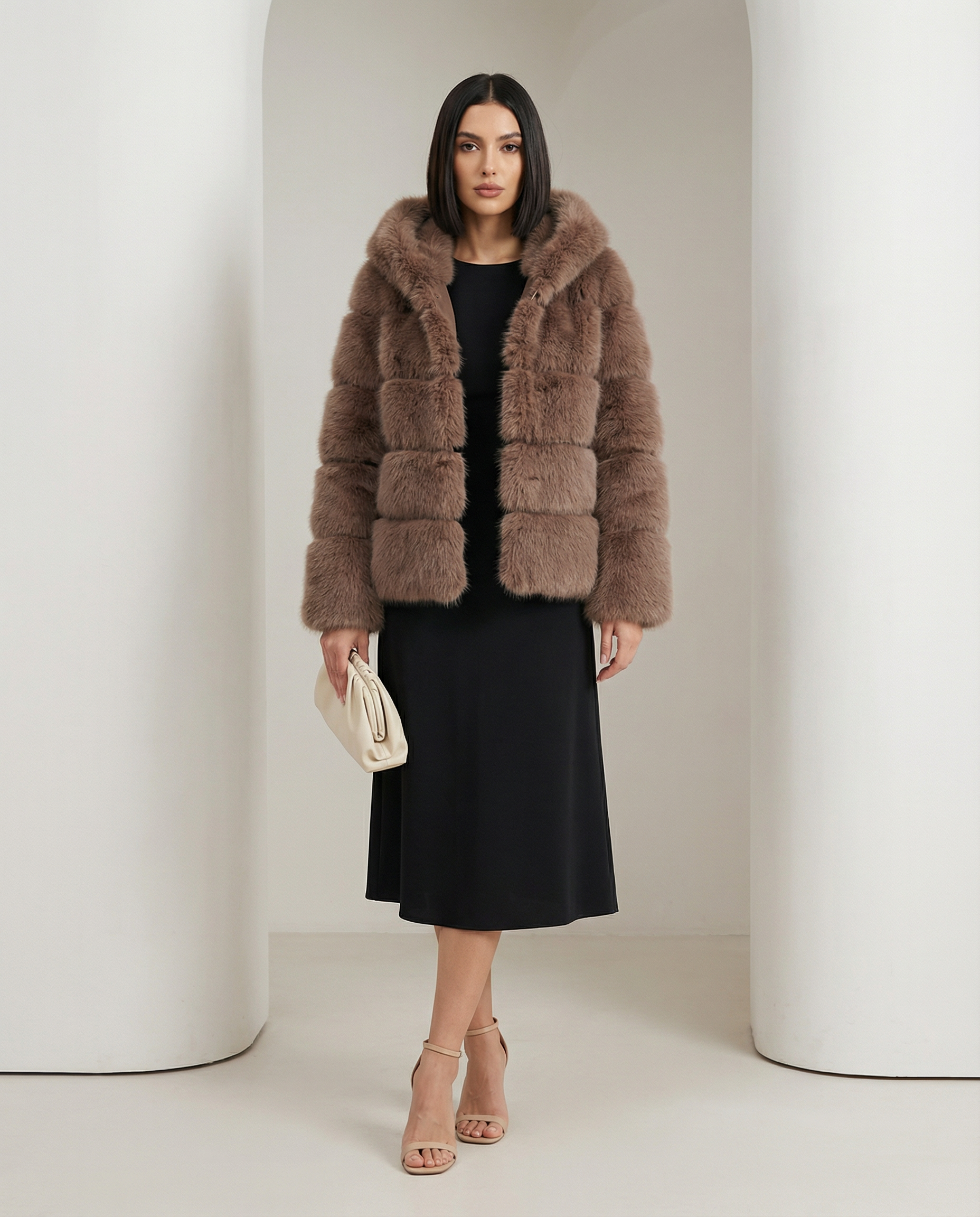 Taupe brown Nova faux-fur bubble jacket worn open over a black midi dress, full length front view
