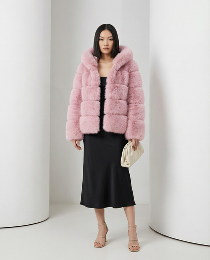 Pink Nova faux-fur bubble jacket worn open over a black slip midi dress, full length standing
