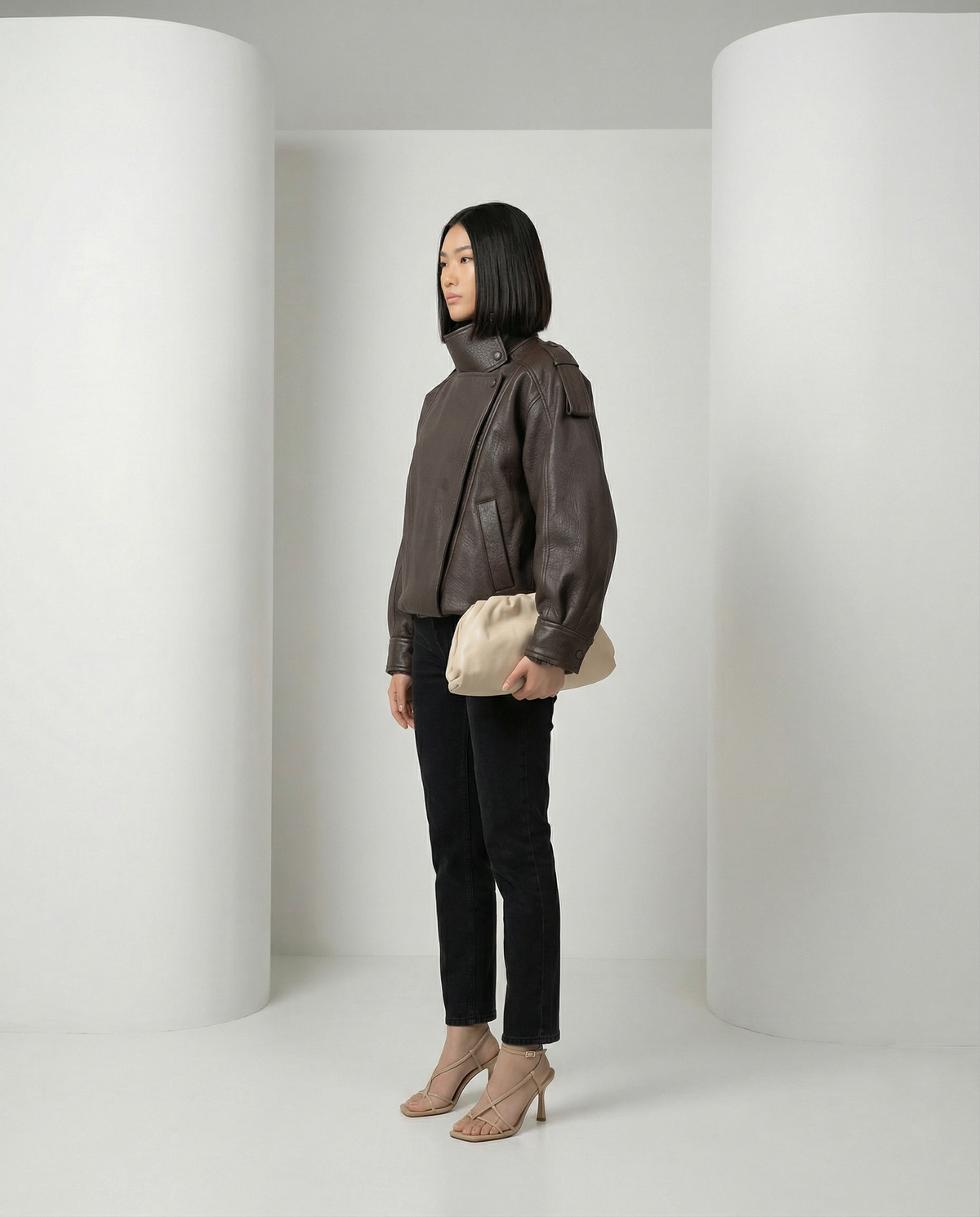 Bitter chocolate Onyx Jacket in profile, flap pocket and dropped shoulder visible, full length