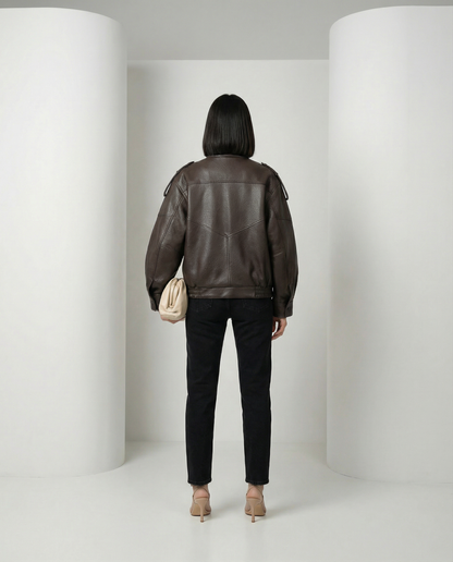 Bitter chocolate leather-look bomber seen from the back, wide sleeves and elasticated hem