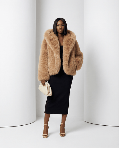 Ravena hooded faux-fur jacket in amber fox, hood down, front view over a black midi dress
