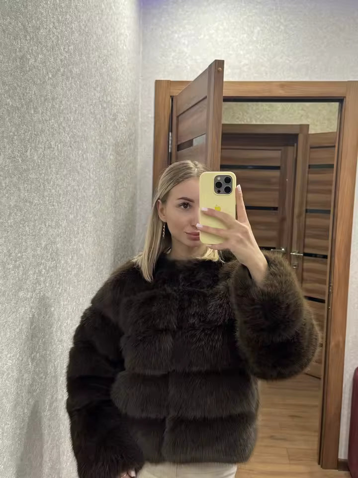 Mirror selfie in a dark brown panelled faux-fur jacket, taken in a wood-panelled hallway