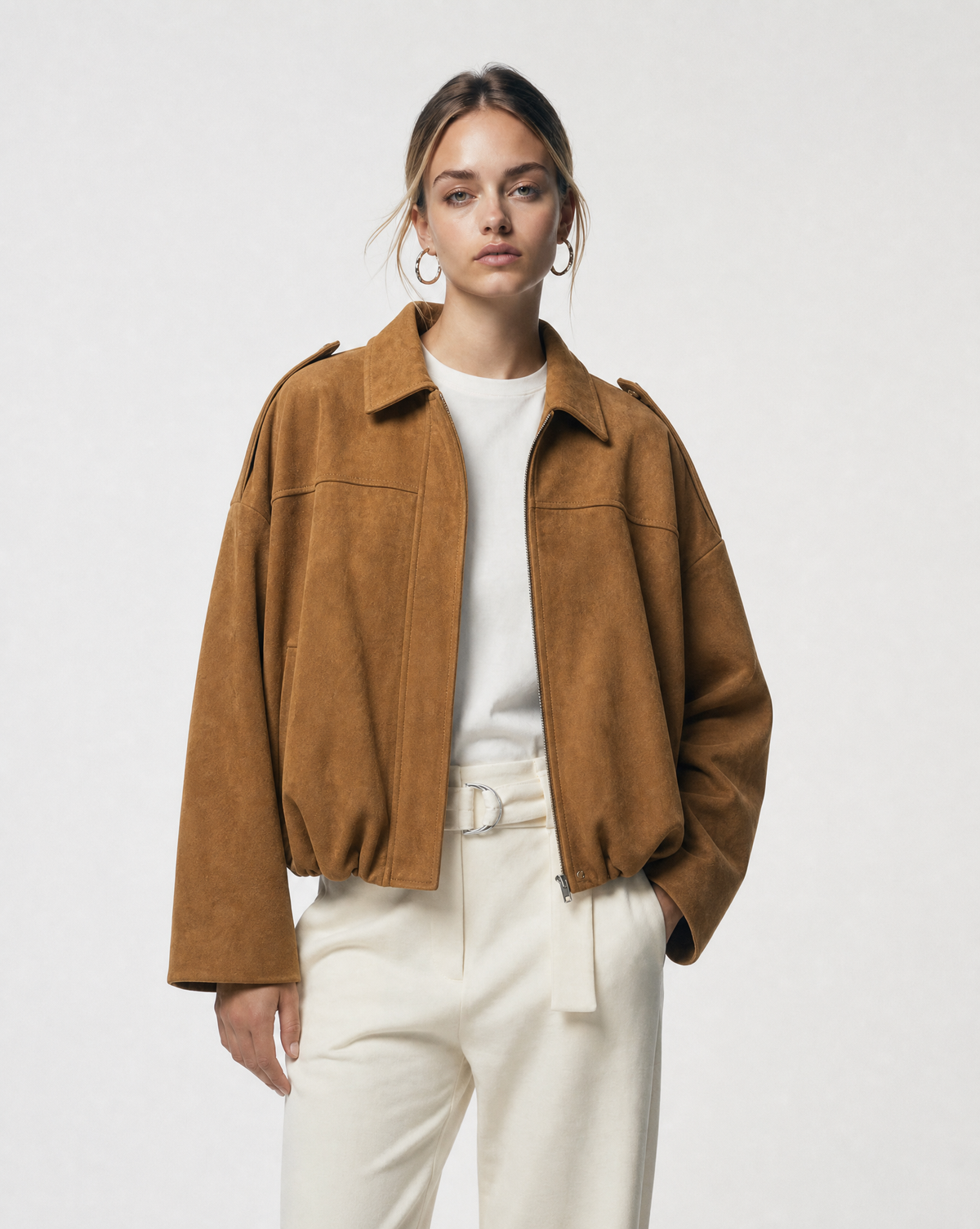 Tan Amber Fox Selena Jacket in suede, worn open over a white tee and cream trousers, waist up