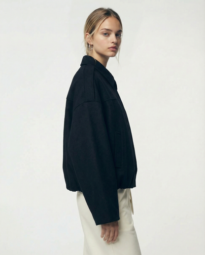 Black Selena Jacket from the side, oversized cropped bomber with a folded collar, cropped at the hip