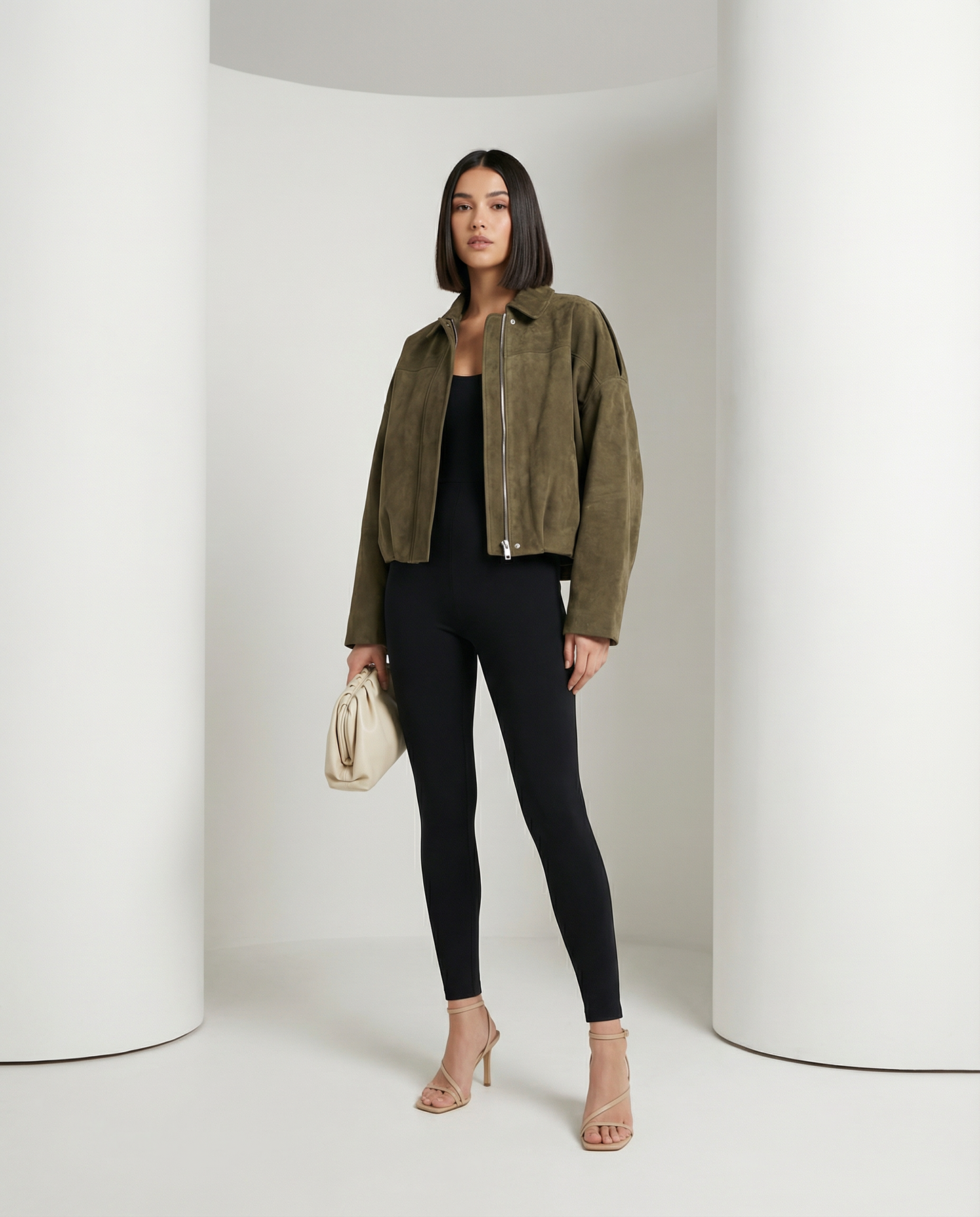 Olive-green Tundra Selena Jacket in suede, worn open over a black top and leggings, full length front