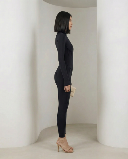 Black Selene Sculpt Jumpsuit in strict side profile showing the smooth ankle-length leg line